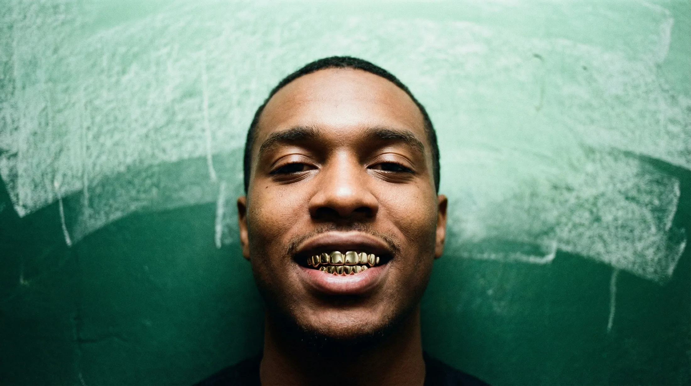 Model wearing custom gold grillz